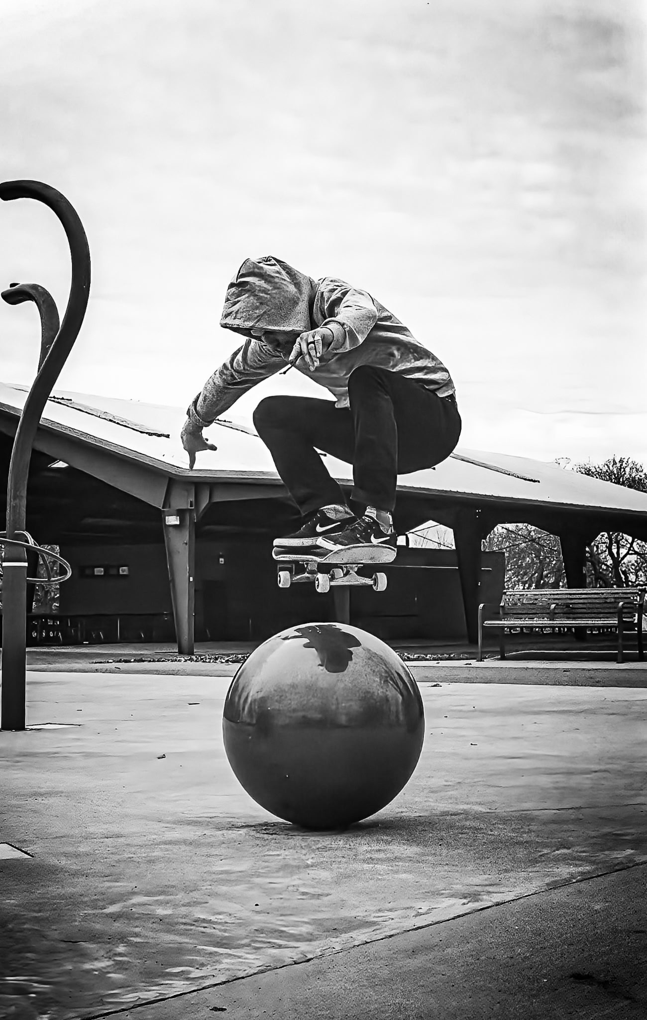 Joe Pelow performing an ollie over an orb.