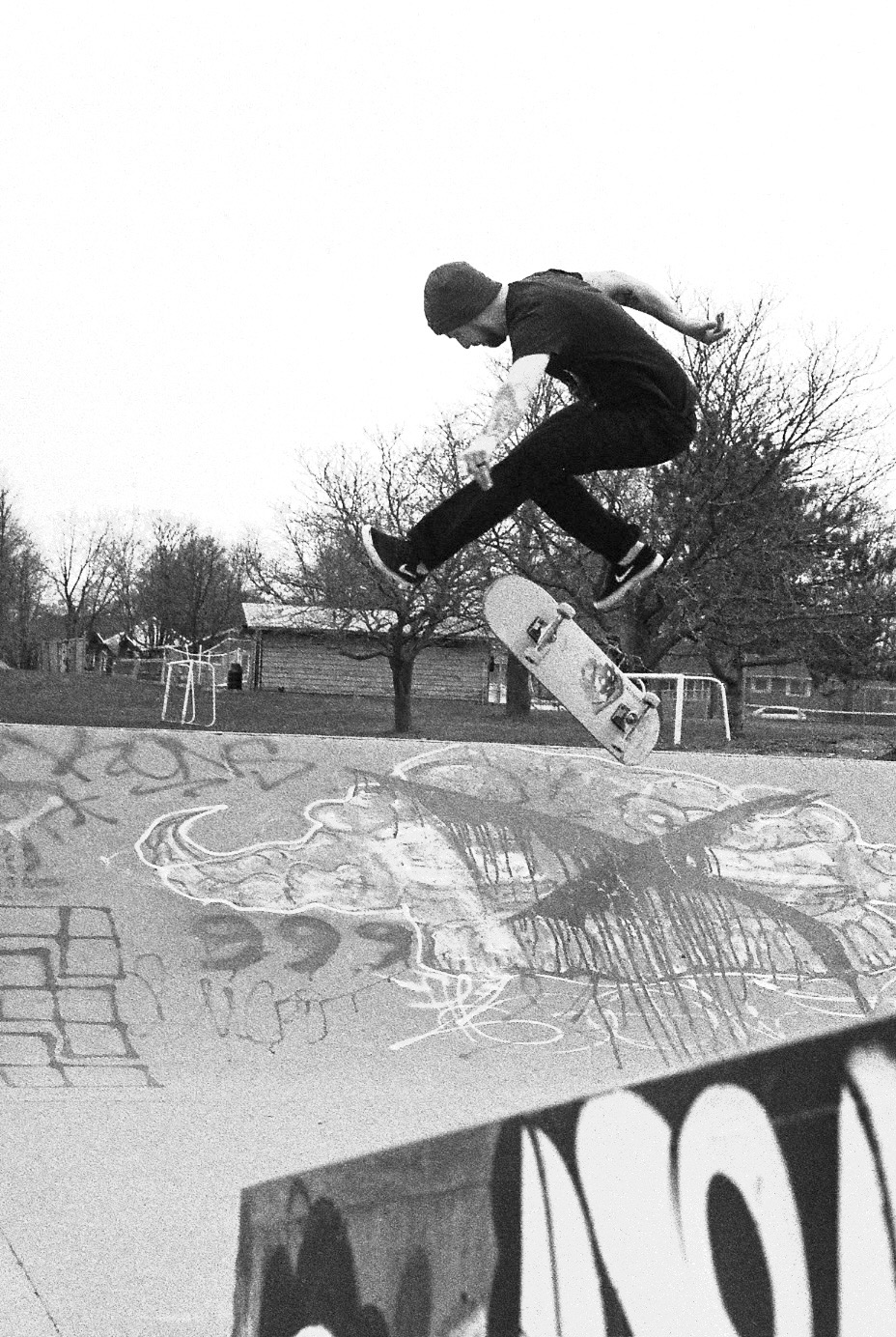 Joe Pelow performing an Inward Heelflip on a bank at the McCullough skatepark.